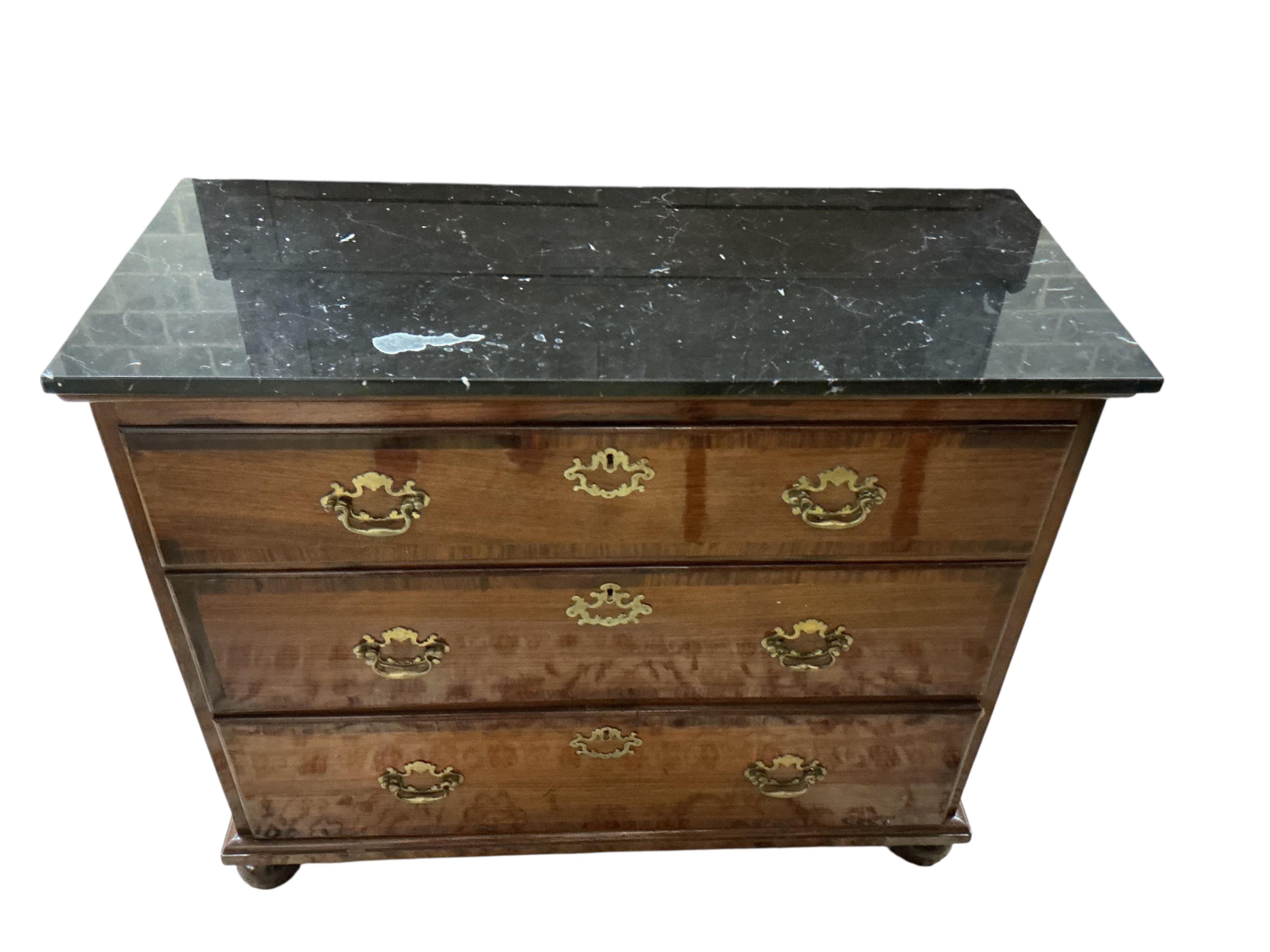 An 18th century and later rosewood veneered chest with associated reconstituted black marble top, width 106cm, depth 46cm, height 88cm